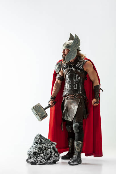 istock Man in cosplaying Thor isolated on white studio background 1147508732