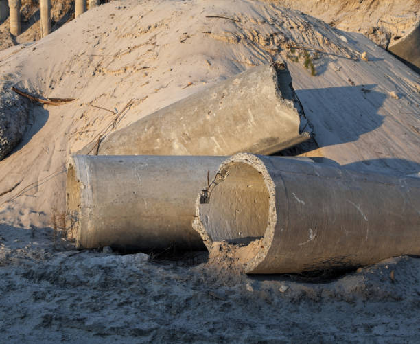 istock Concrete pipes (tubes) near the sand pile 1147508806