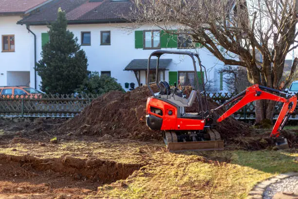 Conventional crawler excavator digging a pit without a driver