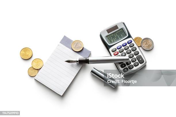 Office Note Book Calculator Coins And Pen Isolated On White Background Stock Photo - Download Image Now