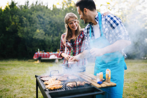 istock Young people grilling outdoors 1147510679