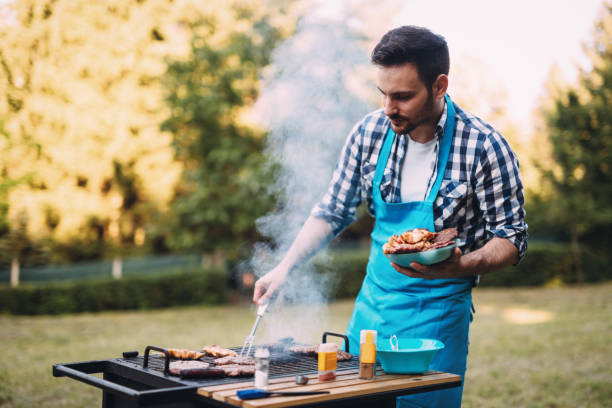 istock Happy male preparing bbq meat 1147510686