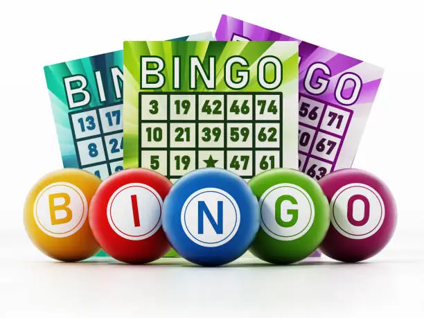 Photo of Bingo game cards and colored balls forming BINGO text