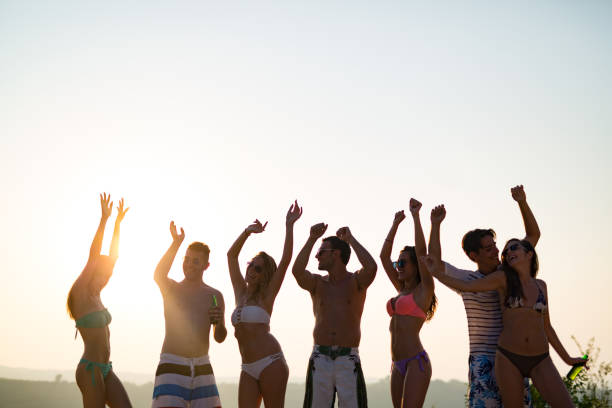 istock Friends partying during summer vacation 1147514601