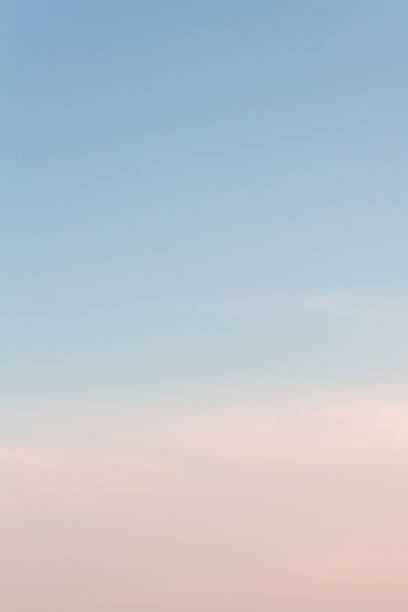 istock Beautiful sunset sky with feathery pink clouds in spring 1147515346