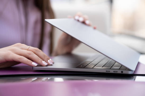 istock Women's hands open or close the laptop 1147516382