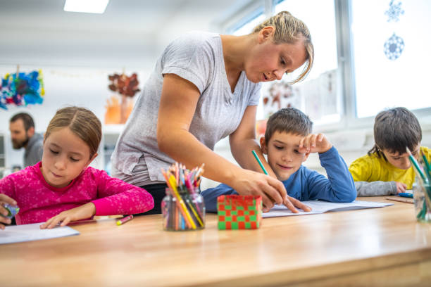 istock Female teacher explaining something to student 1147517056