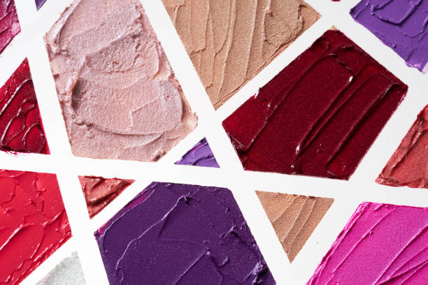 istock Texture of multi-colored strokes of various make-up cosmetics on a white 1147519352