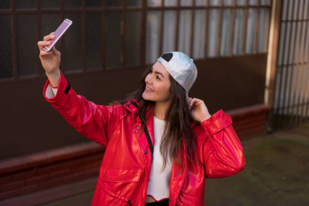 istock Young beautiful girl is making selfie 1147519383