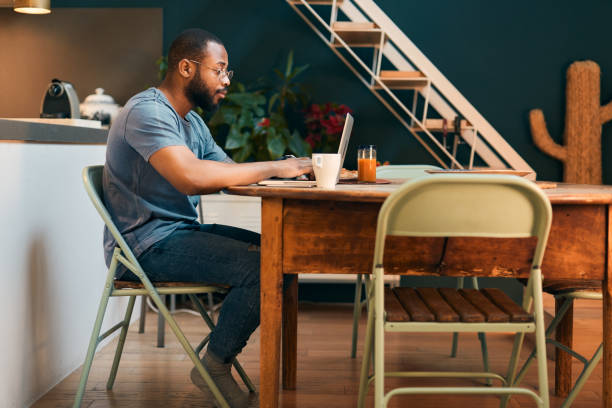 istock Young millennial using technology for his investment and on line banking. 1147519451