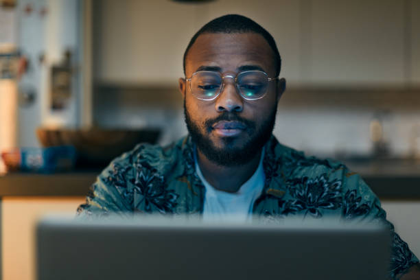 Young millennial using technology for his investment and on line banking.