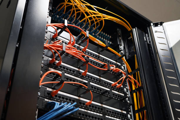istock Network cabinet with rj45 and fiber cables 1147519669