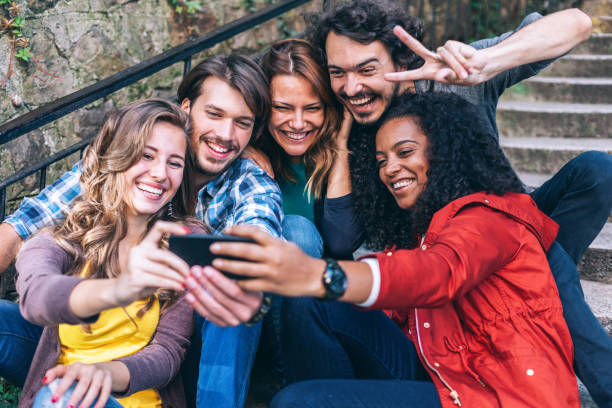 istock International friends taking selfie 1147519685