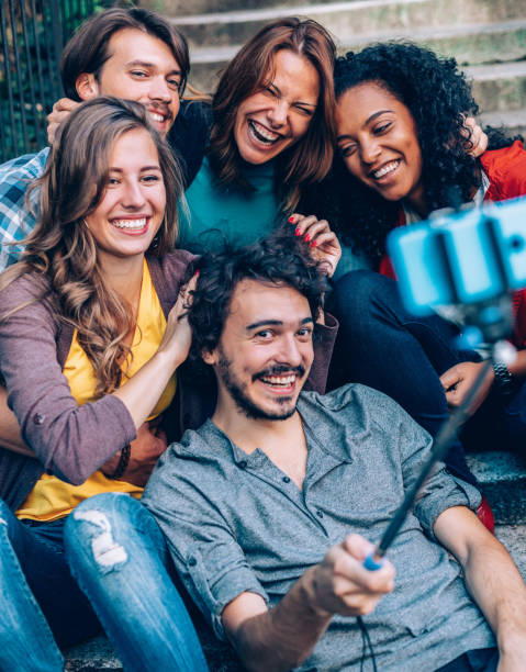 istock International friends taking selfie 1147519700