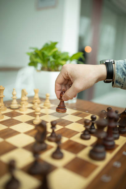 istock Man playing chess. Concept of business strategy and tactic 1147520004