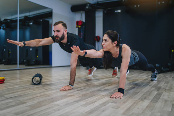 istock Two handsome friends working out together at the gym 1147520951