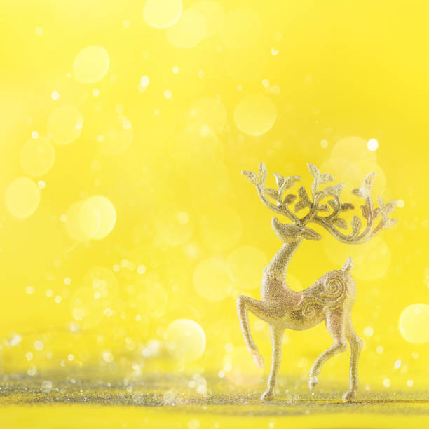 istock Silver glitter Christmas deer on yellow background with lights bokeh, copy space. Greeting card for new year party. Festive holiday concept. Square crop 1147521128