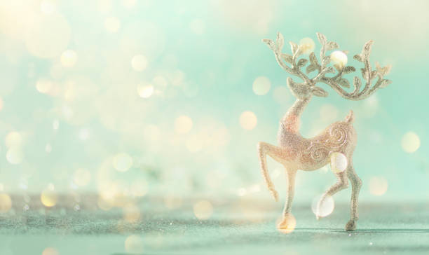 istock Silver glitter Christmas deer on blue background with lights bokeh, copy space. Greeting card for new year party. Festive holiday concept. Banner 1147521144