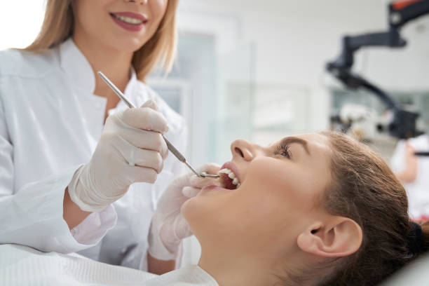 istock Dentist treating woman's teeth in dentistry. 1147521453
