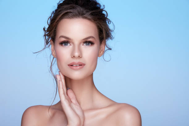 istock Beauty photo at blue studio background 1147523356