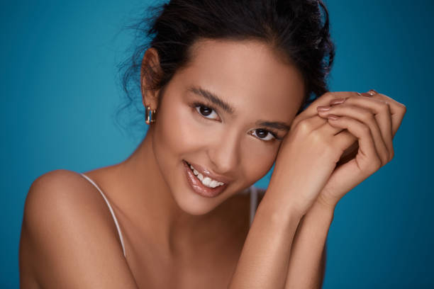 istock Cute girl at blue background 1147524300