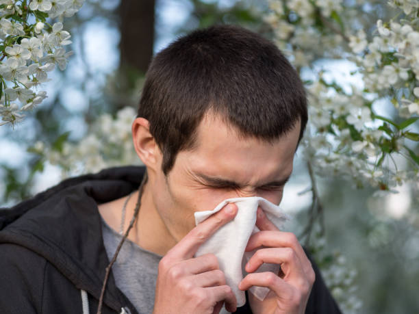 istock Springtime allergies and flu. The man with the handkerchief 1147524561