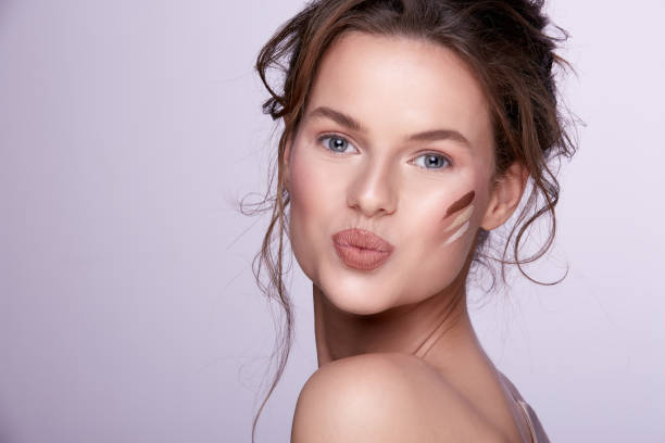 istock Pretty woman posing at gray background 1147524625