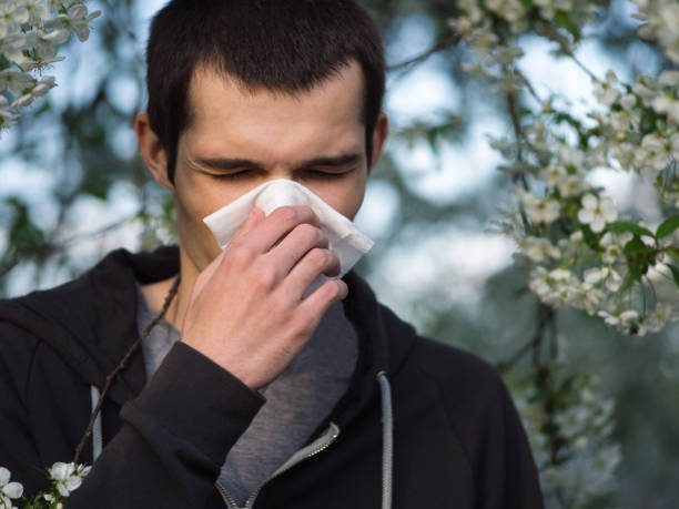 istock Springtime allergies and flu. The man with the handkerchief 1147524628