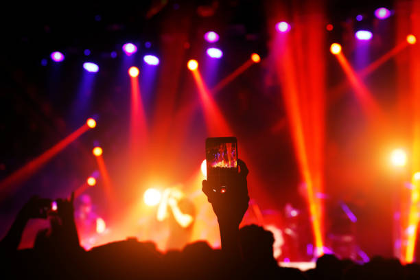 istock Shooting on mobile phone. Concert on stage. 1147526555