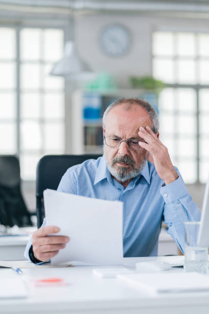 istock A senior businessman working in his modern office 1147526570