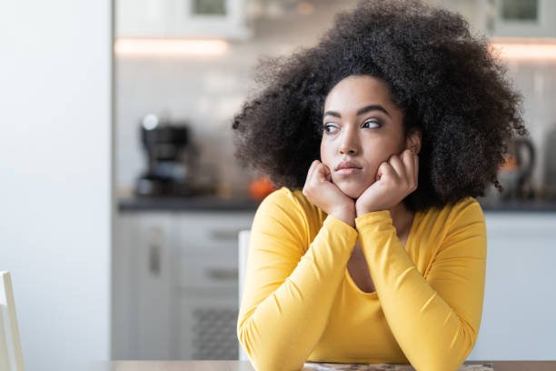 istock Depressed afro woman at home 1147527379