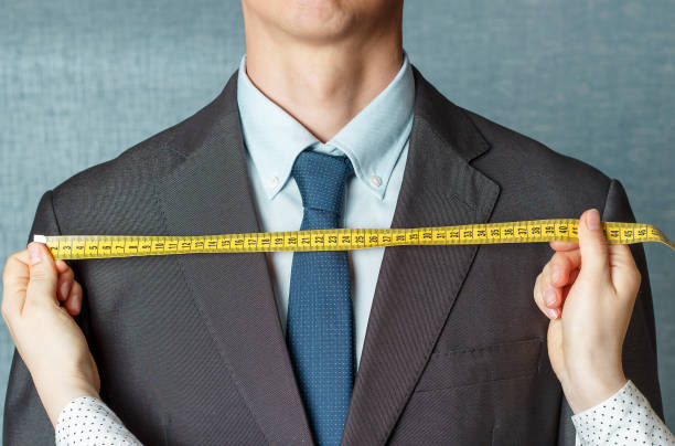 istock The tailor measures the suit with a measuring tape close-up 1147528580