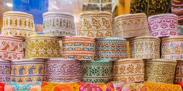 Colorful Omani Caps on retail display during Ramadan.
