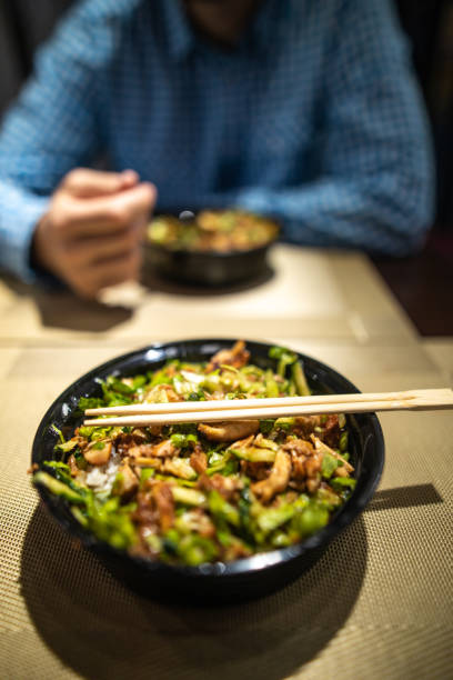 istock Chinese food in bowl with chopsticks 1147531932