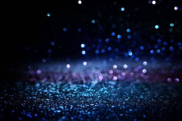 istock glitter vintage lights background. black silver and blue. de-focused 1147534027