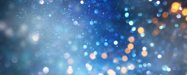 istock glitter vintage lights background. black silver and blue. de-focused 1147534073