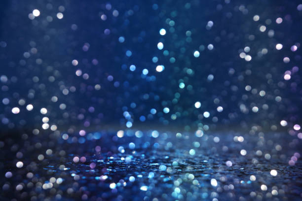 istock glitter vintage lights background. black silver and blue. de-focused 1147535021