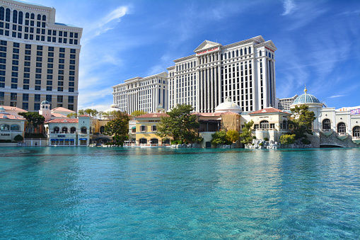 Las Vegas, USA - March 18, 2018 : Fountains of Bellagio - Bellagio Hotel & Casino and Caesars Palace in the background.