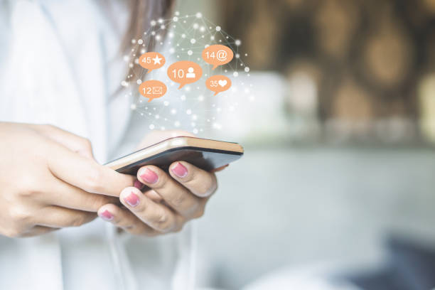 istock woman hand using smart phone with technology social media and network icon 1147537378