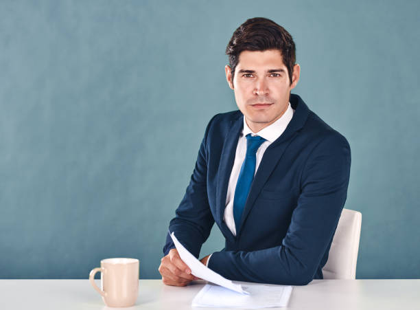 Breaking news Cropped portrait of a handsome young male newscaster sitting in the newsroom newscaster photos stock pictures, royalty-free photos & images