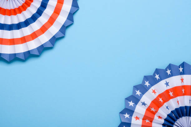 istock USA theme paper fans on blue background flat lay 1147539799