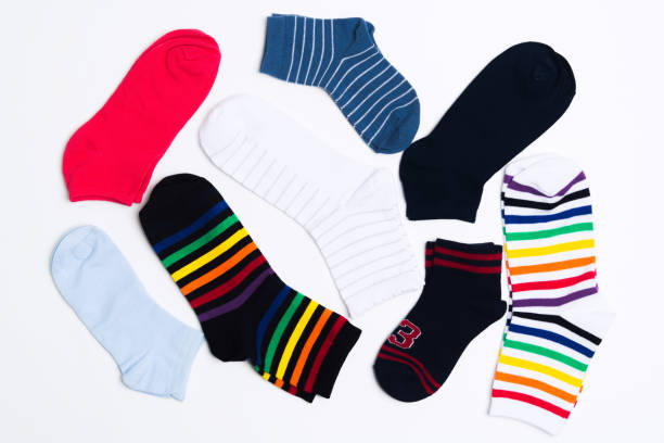 istock Many various colorful textile socks for warm weather. Legs clothes on white background 1147540483