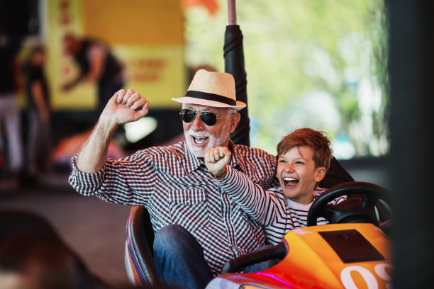 istock Grandfather and grandson amusement park fun 1147540967
