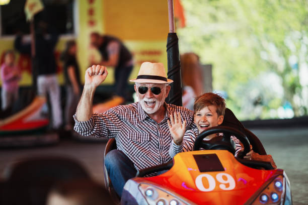 istock Grandfather and grandson amusement park fun 1147541194