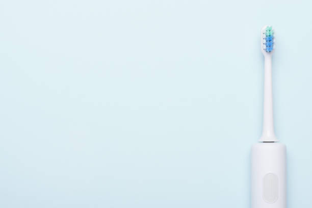 istock Electric toothbrush. Sonic tooth brush on blue background 1147541207