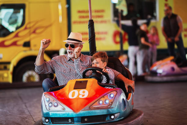 istock Grandfather and grandson amusement park fun 1147541238
