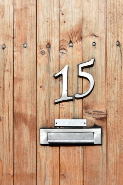 istock House number 15 on the door with post box 1147541360