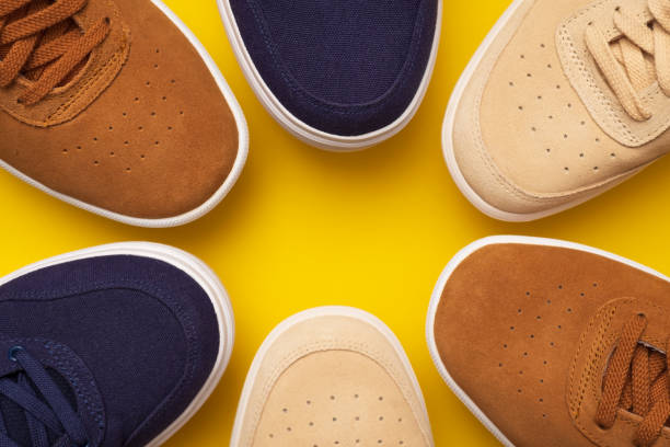 istock Three pair of sneakers on colored background 1147541591
