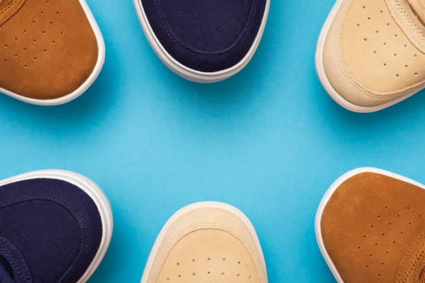 istock Three pair of sneakers on colored background 1147541650
