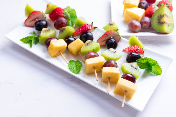 istock Ripe fruit in season on skewers 1147542860